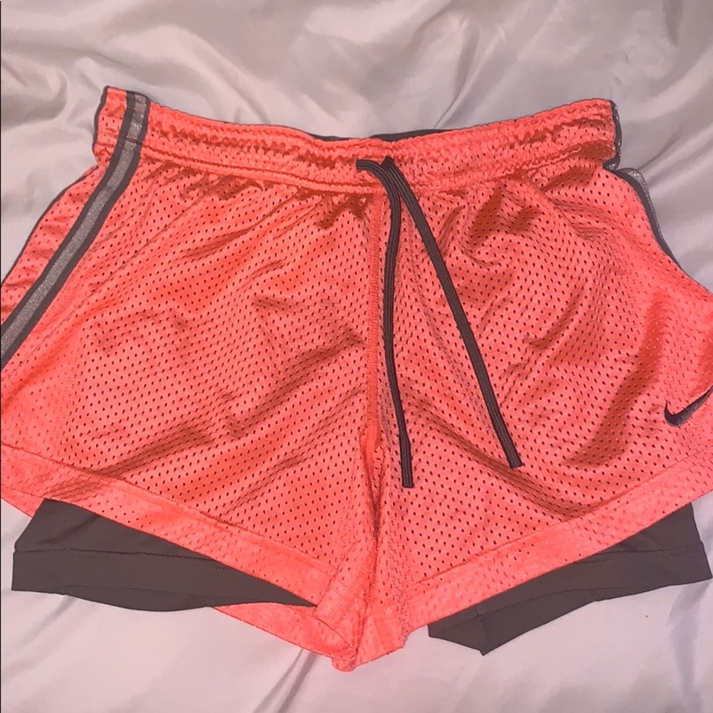Nike bright orange running shorts